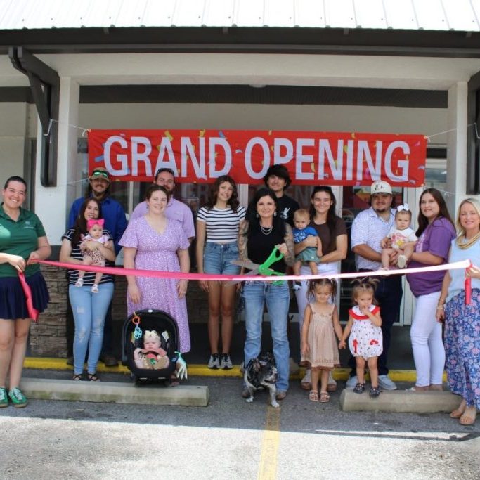 Nails by Fara owner Fara SIrmans is joined by family, friends and chamber officials at their grand opening and ribbon cutting on June 7th. 